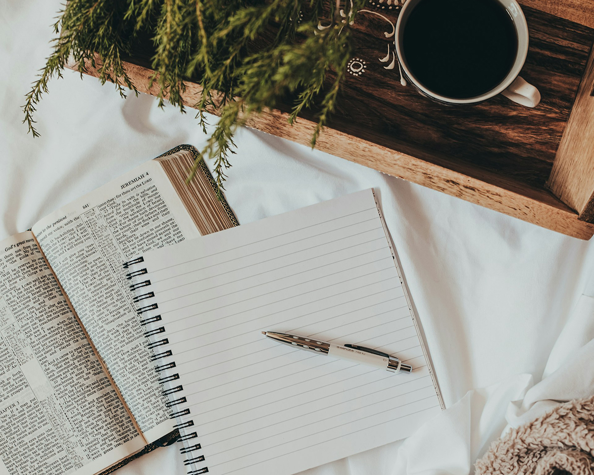 Photo of bible, notebook and coffee for the New Year’s Resolutions blog post