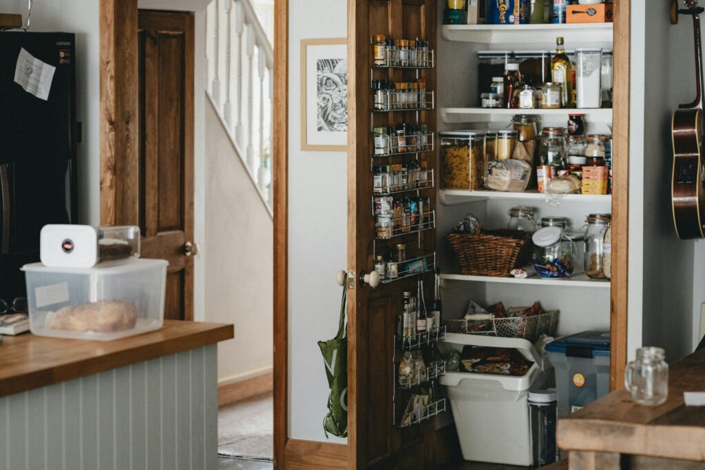 white plastic trash bin beside brown wooden shelf for devotional The Pantry of Life